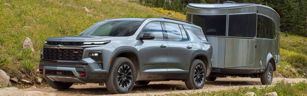 2025 Chevy Traverse hauling a trailer up a mountain